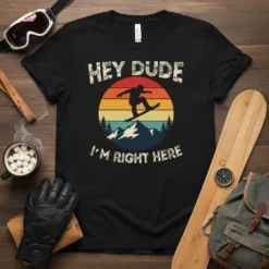 Retro "Hey Dude I'm Right Here" snowboarder t-shirt design with a sunset and mountain graphic