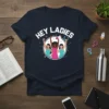 Hey Ladies feminist empowerment t-shirt design featuring three diverse women with raised fists and a megaphone