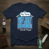 Navy t-shirt with blue and white text: "Hey Trump GET OUT OF OUR HOUSE! —We the People" inside a house