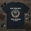 Hide Your Wife The Alpha Is Here bold white text design with a fierce wolf head graphic on a navy
