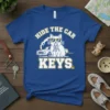 Hide The Car Keys t-shirt design with a sunglasses-wearing cat holding keys and a vintage car graphic