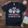 Hippo Bubble Blowers Club text with three hippos blowing pink and green bubbles, wearing sunglasses and hats on a navy