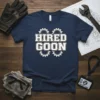 Navy blue t-shirt with bold white text 'HIRED GOON' and gear graphics, ideal for mechanics and tradesmen