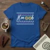 Blue t-shirt with "Hm boob" text and green Celtic knot graphics, framed by white and pink geometric patterns