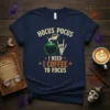 Hocus Pocus I Need Coffee To Focus Halloween T-Shirt design with cauldron, skeleton hand, and coffee cup