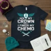 Hold My Crown While I Finish My Chemo t-shirt design with teal ribbon, wings, and crossed swords graphic