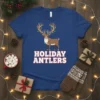 Holiday Antlers t-shirt design with a cartoon reindeer wearing Christmas lights on its antlers and neck