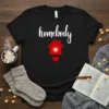 Black t-shirt with white "homebody" text and a red house graphic with a glowing heart inside, and a red heart