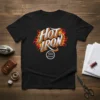 Black t-shirt with "HOT IRON" text in bold white and grey, surrounded by orange and yellow flames. Includes a small
