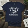Navy blue t-shirt with white text "HOUSELESS Not Homelos" and graphic of a camper van inside a house outline