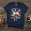 T-shirt with "How Many Nights a Week Should You Be Reading? 6-7" text, featuring an open book, moon, stars, clouds