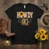 Black t-shirt with "Howdy" text, sunflower, cowboy boot, and horseshoe graphic in vintage style