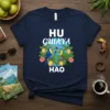 HU GUAYAYA HAO text design with toucans and guayaba fruit, vibrant tropical theme on navy blue t-shirt