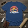 Huatulco Mexico t-shirt with vintage beach, mountain, and surf graphic. Features text "HUATULCO" and "-Mexico-"