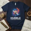 Navy t-shirt design featuring the Hubble Space Telescope with a colorful galaxy spiral and text "HUBBLE Hubble Space Telescope"
