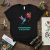 Hummingbird & Blossom text on a black t-shirt featuring a colorful hummingbird and pink flower design