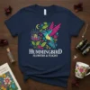 Navy t-shirt with colorful hummingbird, flowers, moon, and stars design text "HUMMINGBIRD FLOWERS & FLIGHT"