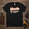 Hustle & Motivate text design on a black t-shirt with graphic elements, promoting a mindset of hard work and inspiration