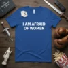 Blue t-shirt with white text "I AM AFRAID OF WOMEN" and a small running man graphic on a sticky note