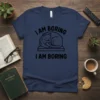 I Am Boring I Am Boring text with a sleeping cat graphic on a navy blue t-shirt