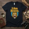 I Am Brave quote t-shirt with a roaring lion graphic and blue lightning bolts, designed for strength and courage
