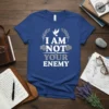 I Am Not Your Enemy text design with a white dove and laurel wreath graphic on a blue t-shirt
