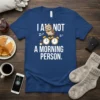 T-shirt with "I Am Not A Morning Person" text, a sleepy owl on alarm clocks, and Zzz graphics