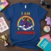 I Am Offended text with a dark purple unicorn and rainbow graphic on a navy blue t-shirt