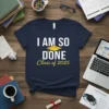 Navy blue t-shirt with white and yellow text "I AM SO DONE Class of 2025" and a graduation cap graphic