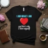 Black t-shirt with "I AM WHAT I AM" in blue and a red heart with "and that's why I love