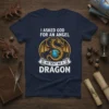 I ASKED GOD FOR AN ANGEL HE SENT ME A DRAGON text with a golden dragon graphic on a navy