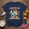 I Baked You Some Shut The Fucupcakes quote on a navy t-shirt with a retro woman illustration holding a rolling