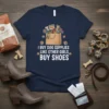 T-shirt with white text "I Buy Dog Supplies Like Other Girls Buy Shoes" above a graphic of a shopping bag
