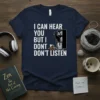 I CAN HEAR YOU BUT I DONT LISTEN funny cat quote t-shirt design with black cat and bookshelf