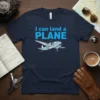 Navy blue t-shirt with "I can land a PLANE" text and a cartoon twin-engine airplane graphic