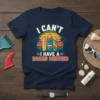 Navy t-shirt with retro sunset graphic and surfboards, text reads "I Can't I Have A Board Meeting"
