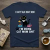 I Can't Talk Right Now I'm Doing Cat Mom Shit t-shirt featuring a black cat with a plunger and a