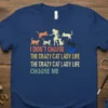 I Didn't Choose The Crazy Cat Lady Life quote with silhouette of woman and cats, vintage distressed text on navy