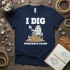 I Dig Horseshoe Crabs T-Shirt with a cartoon horseshoe crab digging in sand, holding a shovel