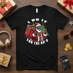 I Do It For The Ho's text with a modern, sunglasses-wearing Santa Claus graphic on a black t-shirt, featuring gift