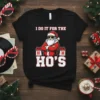 Black t-shirt with "I Do It For The Ho's" text and a sunglasses-wearing Santa Claus graphic, perfect for Christmas humor