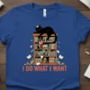 I Do What I Want text with a black cat on a bookshelf graphic on a royal blue t-shirt