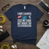 T-shirt with "I Don't Always Test My Code But When I Do It's In Production" quote, error icon, and circuit