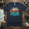 I Don't Catch Feelings I Catch Flights quote t-shirt with airplane graphic and mountains