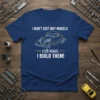 Navy blue t-shirt featuring white text "I DON'T JUST BUY MODELS 1/25 SCALE I BUILD THEM!" and a yellow outline