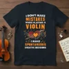 Black t-shirt with bold orange and white text: "I DON'T MAKE MISTAKES WHEN PLAYING A VIOLIN I MAKE SPONTANEOUS CREATIVE