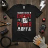 Black t-shirt with red and white text "I Don't Match Energy Power Off" and electrical graphics, featuring a switch and