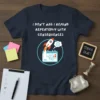 Navy t-shirt with white text "I DON'T NAG I REMIND REPEATEDLY WITH CONSEQUENCES" and graphic of rocket launching from calendar