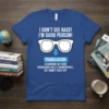 Blue t-shirt with white text and glasses graphic, reading "I Don't See Race! I'm Good Person! Translation: Examining My Own