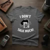 I DON'T TALK MUCH! text with lips and lock graphic on a dark grey t-shirt